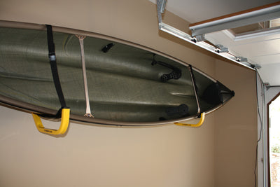 1 canoe mounted on a JAY Rack in a garage