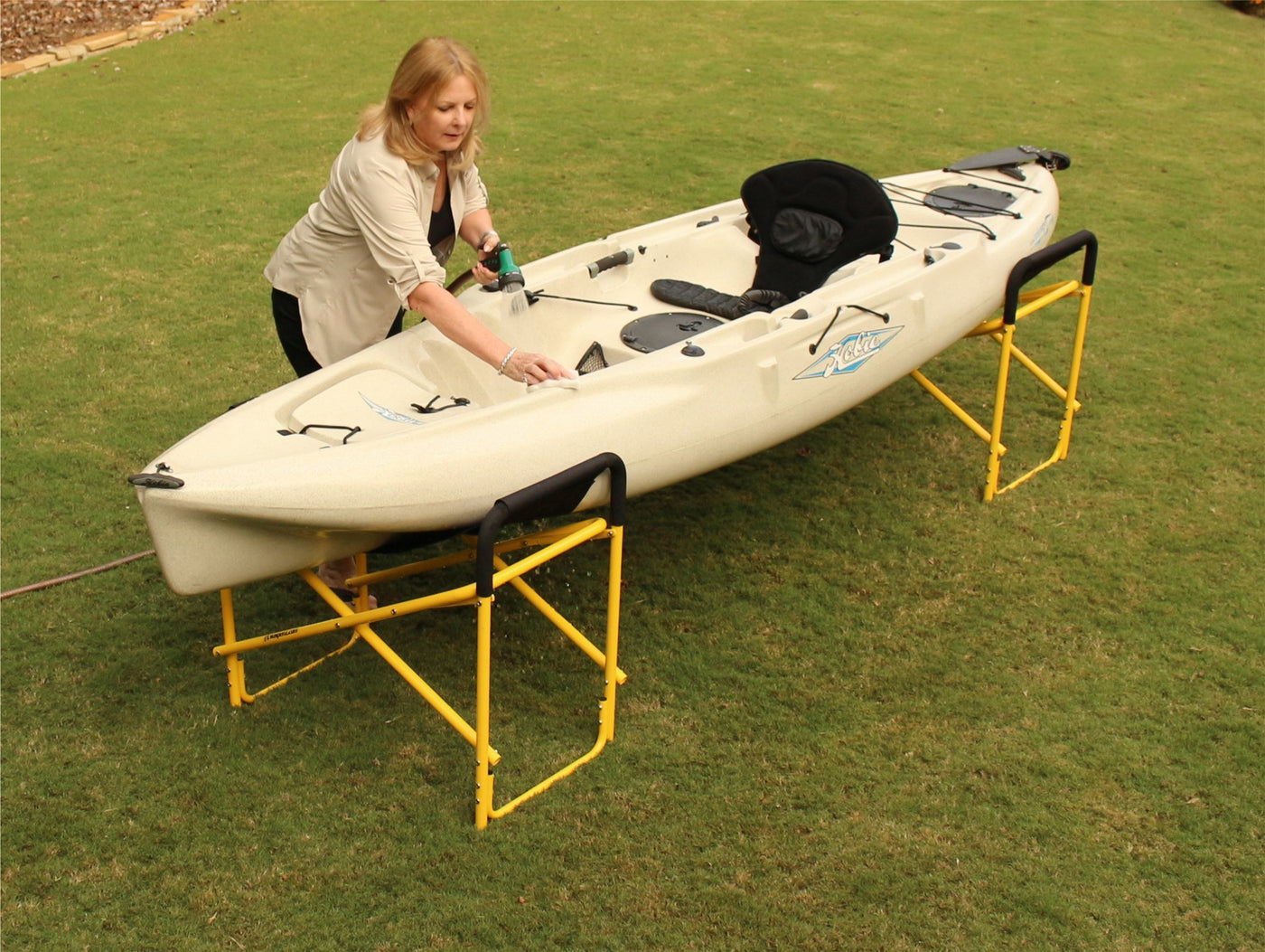 Woman working on a kayak on the big catch