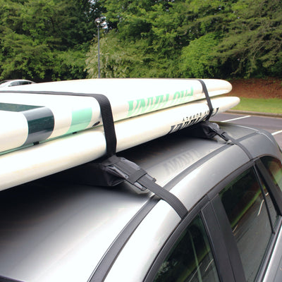 Car with surfboards secured on the roof using a roof rack.