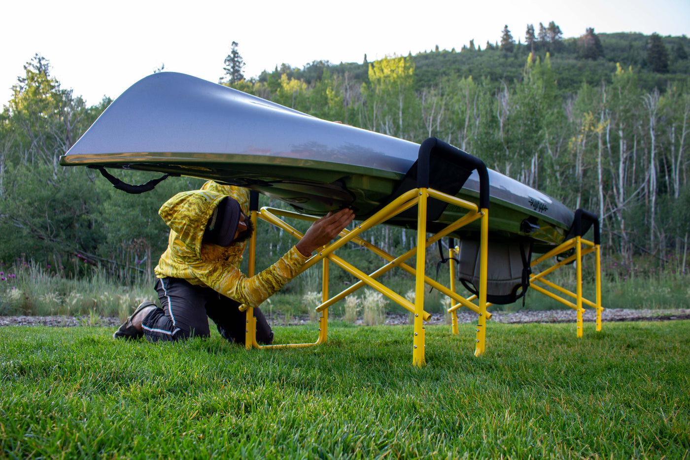 Man working on a canoe on the big catch