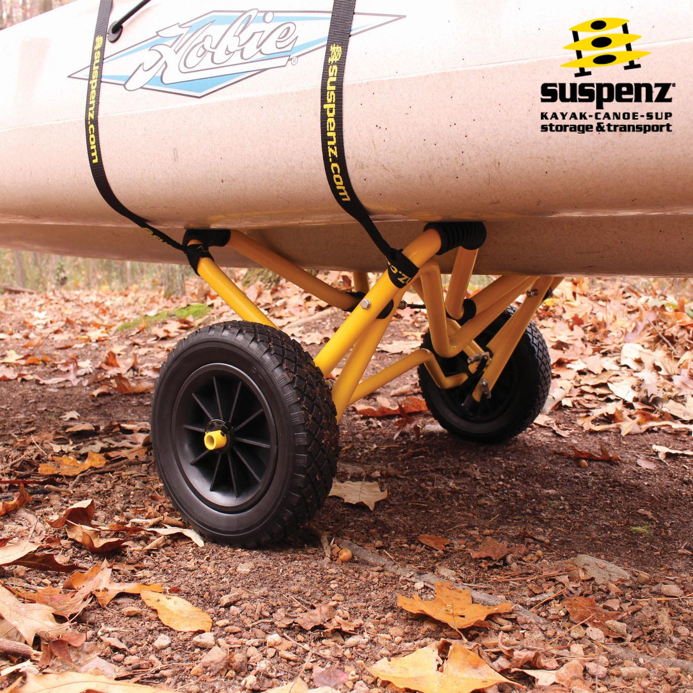A hobie boat strapped to the Heavy Duty Deep V Cart on a dirt trail