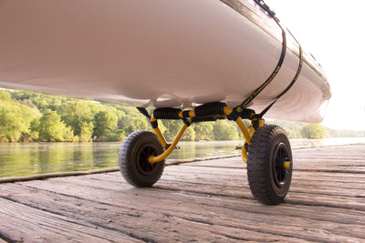 A kayak strapped onto a SK Cart on a dock