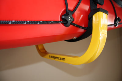 An up close shot of a boat resting on the JAY Rack's straps