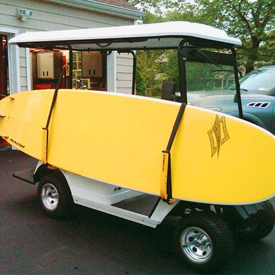 SUP Rack mounted to the side of a golf cart with a yellow SUP loaded.