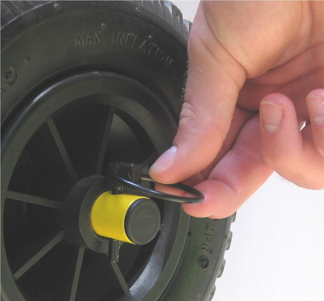 A close up of the quick release tire and pin